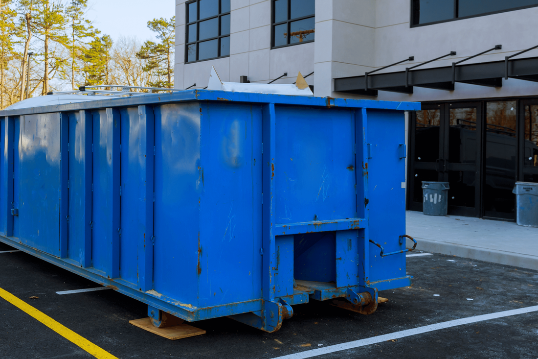 Blue Painted Dumpster Rental at Commercial Office Building