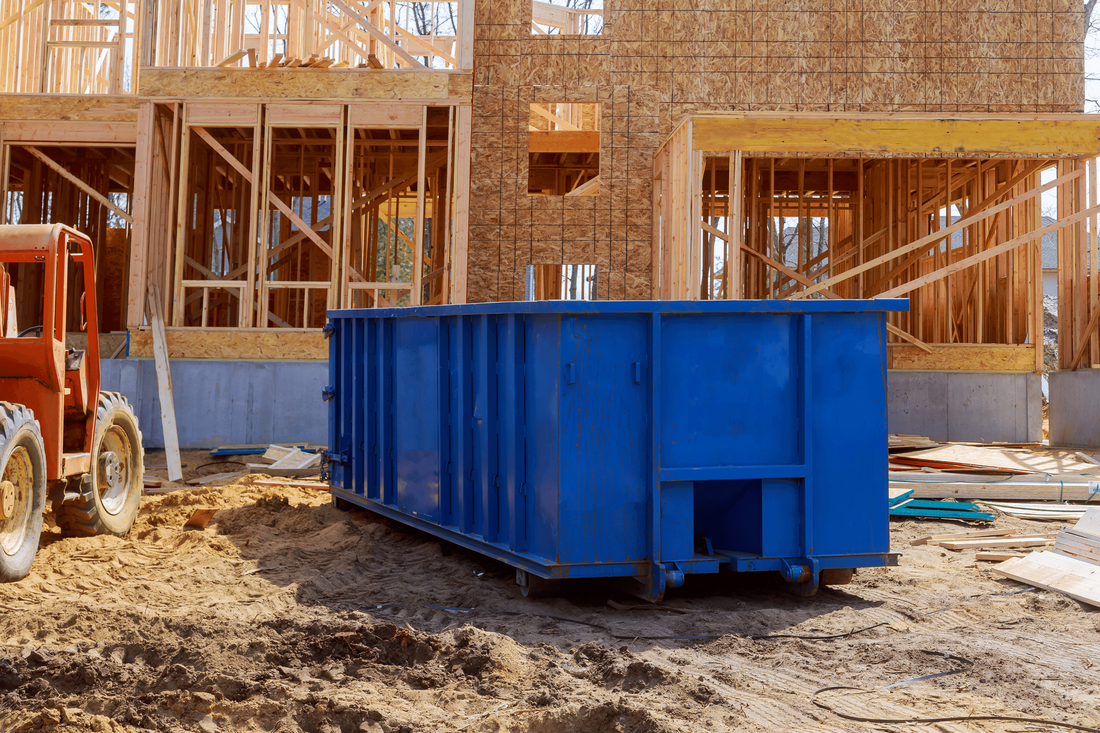 Blue Painted Dumpster for Rent at Project Site Construction